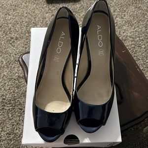 Aldo’s super high heel Shiny Navy Platforms size 10